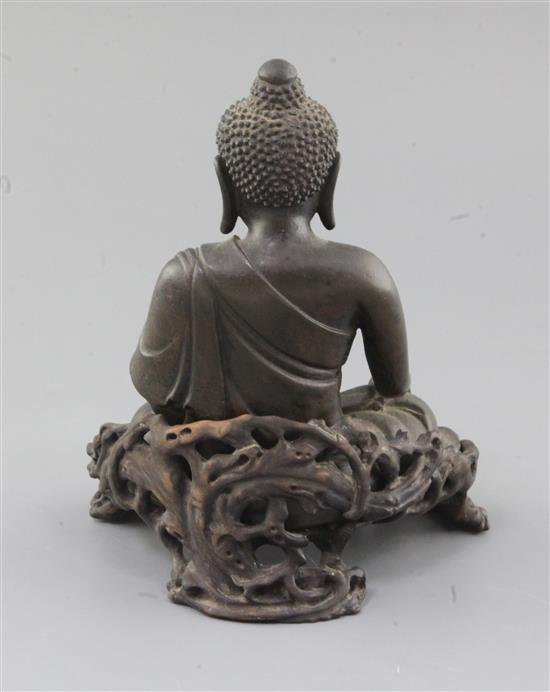 A Chinese bronze seated figure of Buddha Shakyamuni, 18th/19th century, total height 18.5cm